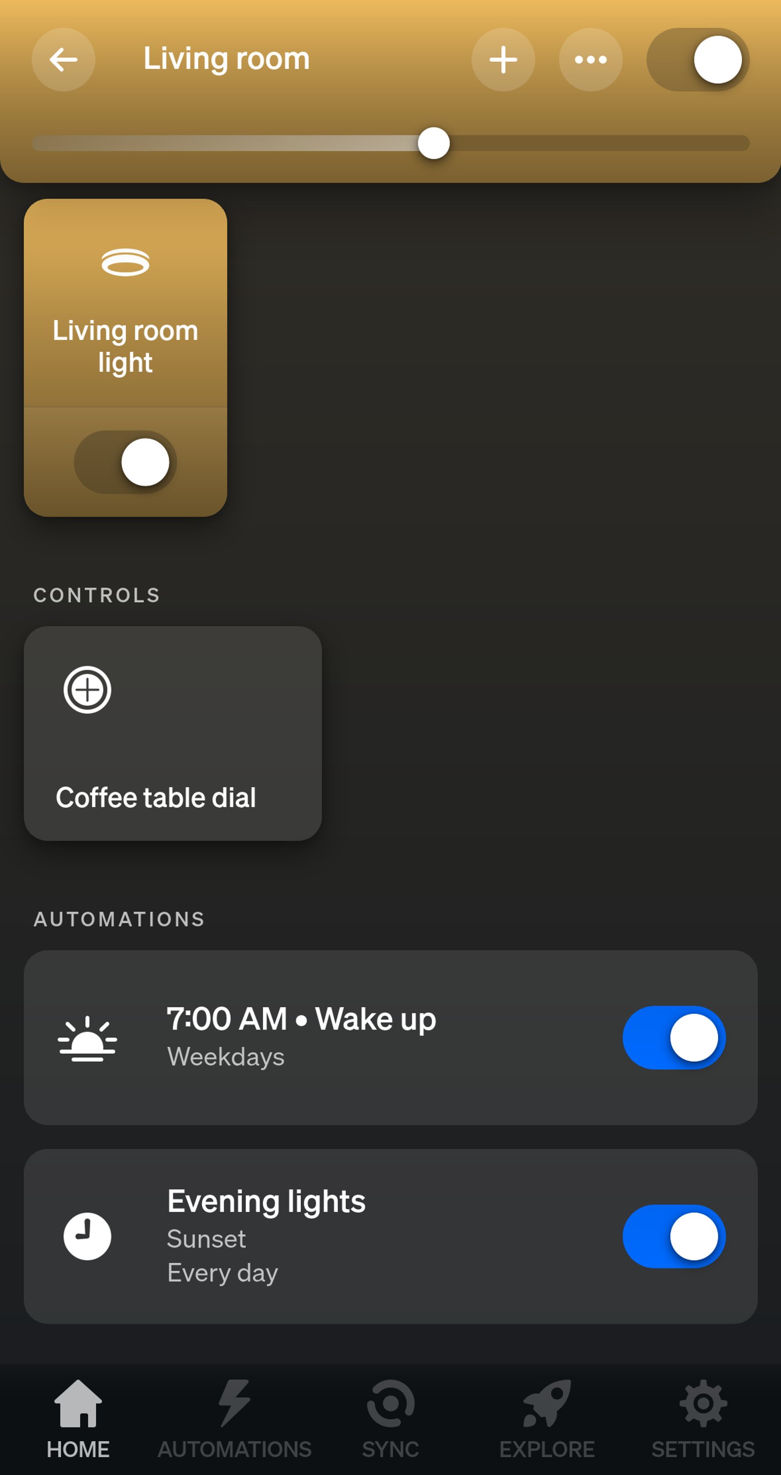 Philips Hue app Living room page listing two automations: Wake up at 7:00 AM on weekdays, and Evening lights from sunset every day.