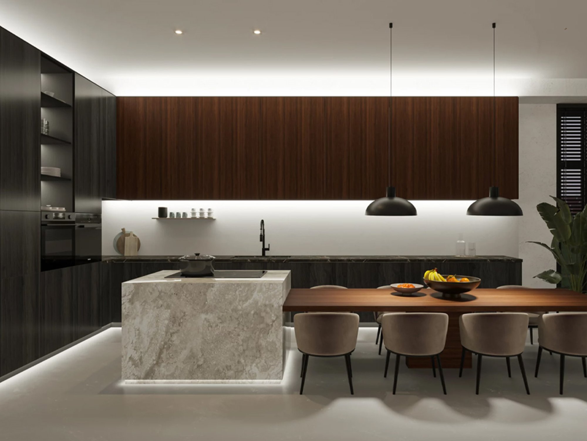 A modern kitchen at night lit by a warm line of LED strip light under the wall cabinets and along the base of the island