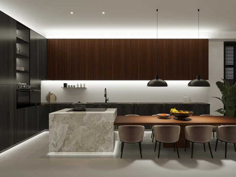 A modern kitchen at night lit by a warm line of LED strip light under the wall cabinets and along the base of the island