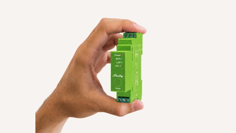 Shelly Pro Dimmer 1PM held in a hand