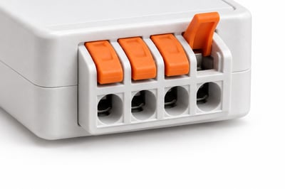 Lever terminals on an LED strip controller, one lever open