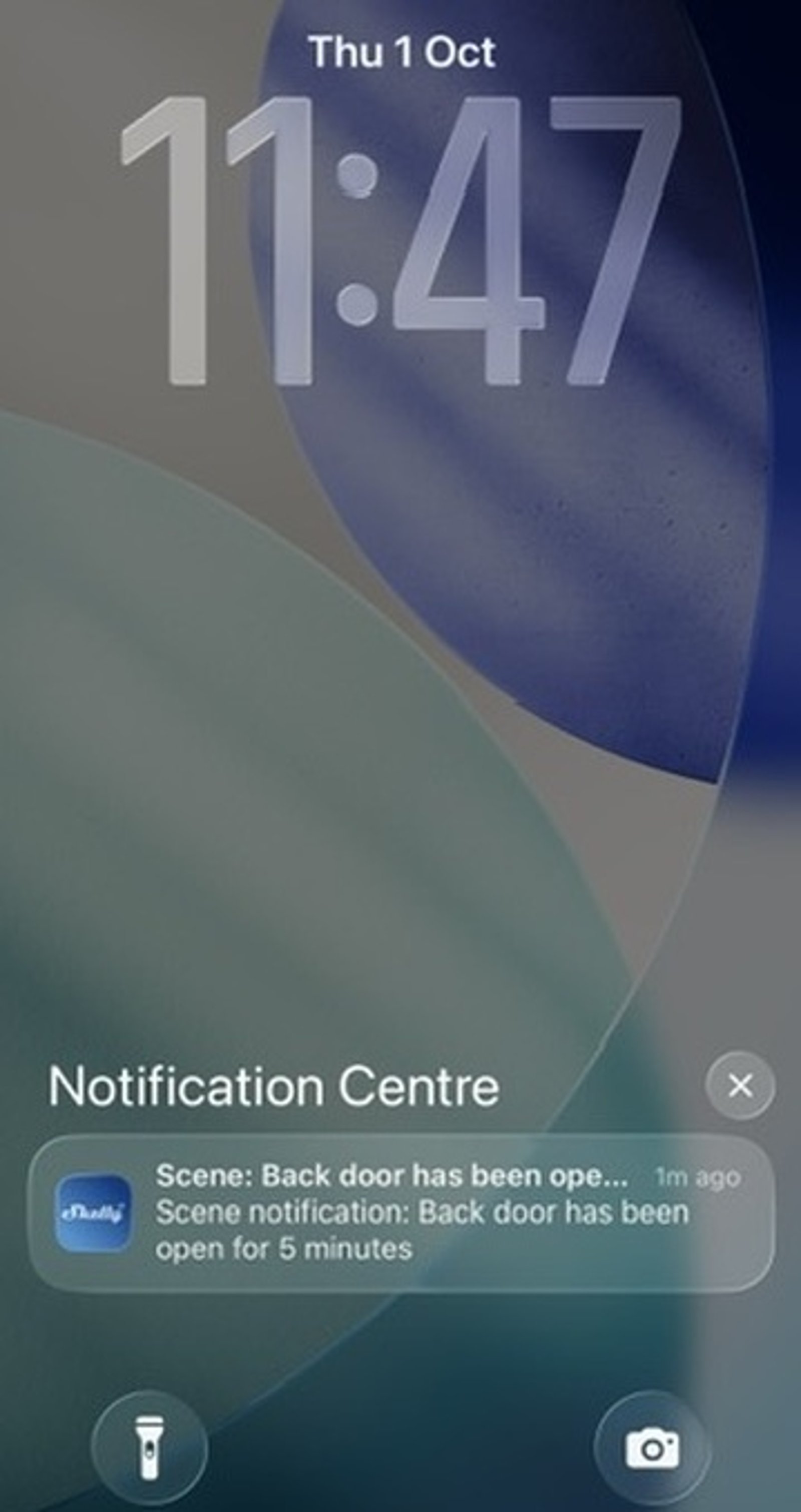 iPhone lock screen with a Shelly notification: Scene notification, Back door has been open for 5 minutes