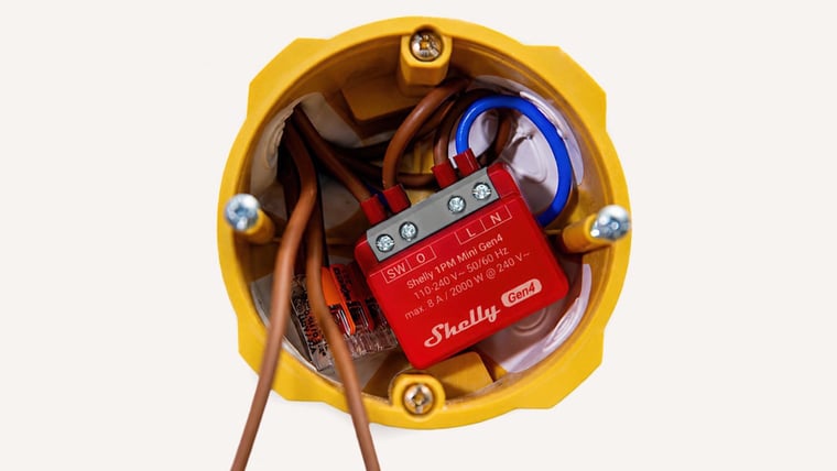 Shelly 1PM Mini Gen4 Smart Relay wired into a wall box