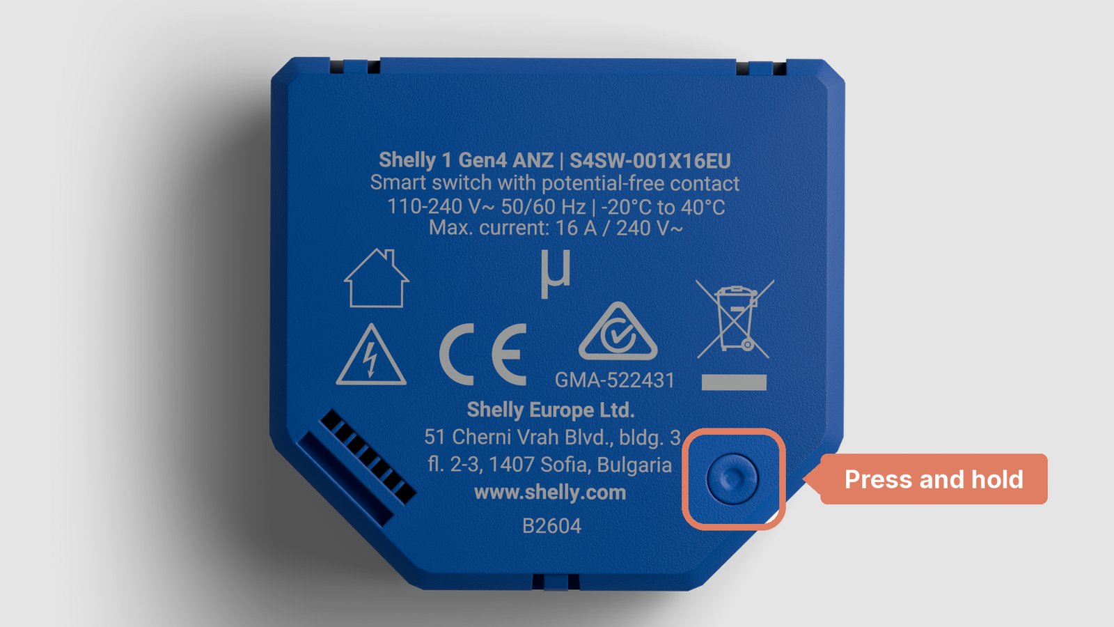 The back of a Shelly 1 Gen4, with the round Reset/control button in the lower right corner marked
